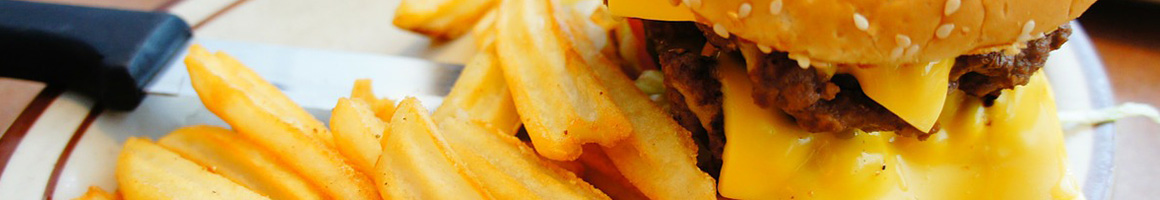 Eating American (Traditional) Burger Sandwich Cheesesteak at Cheesesteak U restaurant in Conway, SC.